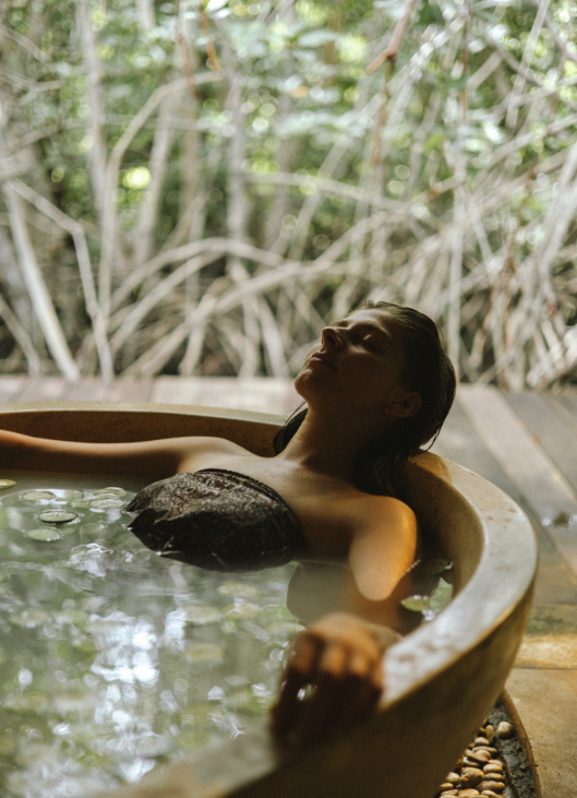 woman soaking in hot spring