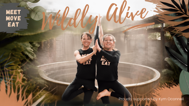 two women in tree pose in front of the Village bathhouse spa